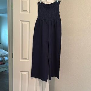 Navy Blue strapless Women's Jumpsuit. I usually wear a medium this large fit.